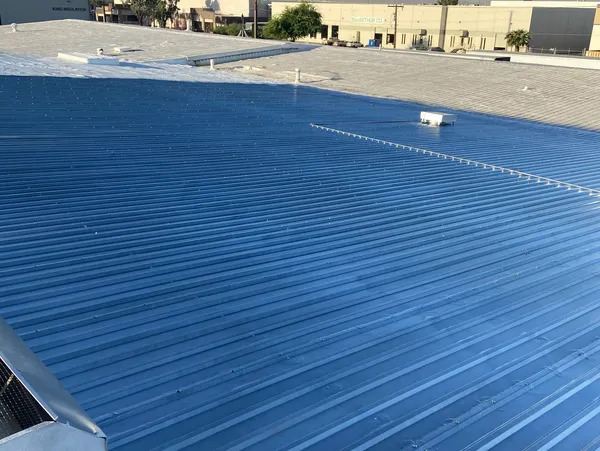 Roof coating being professionally applied to a flat roof in Scottsdale, AZ