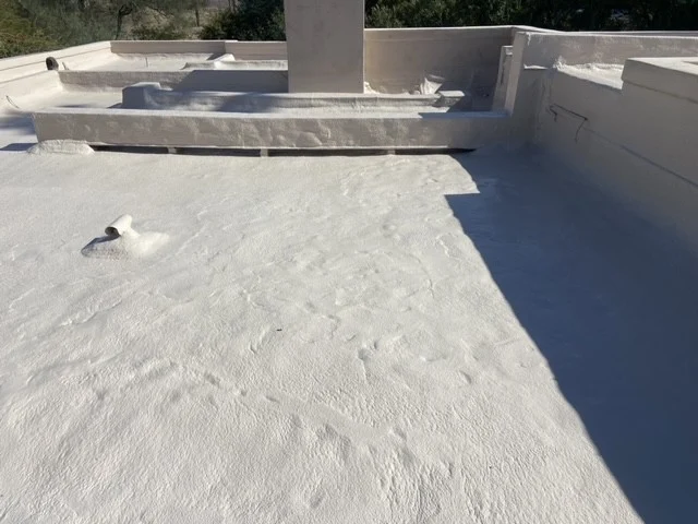 The same foam roof after Circle G Roofing applied new foam and coating