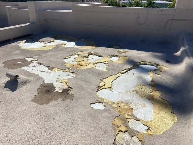 Foam roof before repair, old coating peeling off in patches